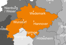 Ansprechpartner Eine Karte, die die Region Hannover in Deutschland in orange hervorhebt, mit den umliegenden Gebieten in grau. Städte wie Wedemark, Wunstorf, Hannover und Springe sind im markierten Bereich eingezeichnet.